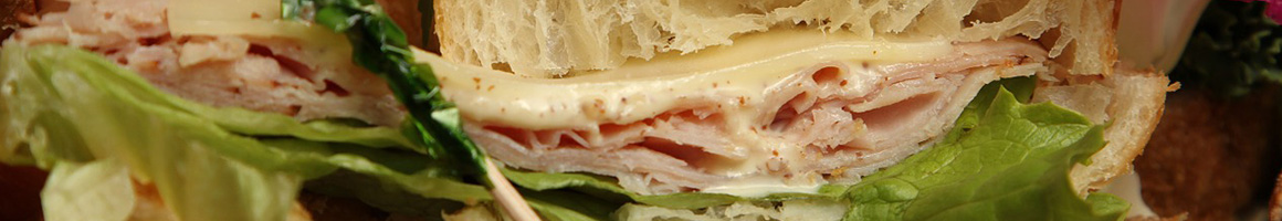 Eating Deli Sandwich at Antoine's Foods restaurant in Dallas, TX.